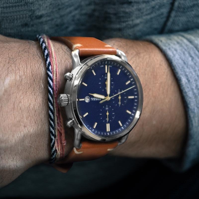 Fossil Commuter watch on wrist styled with casual clothing and accessories