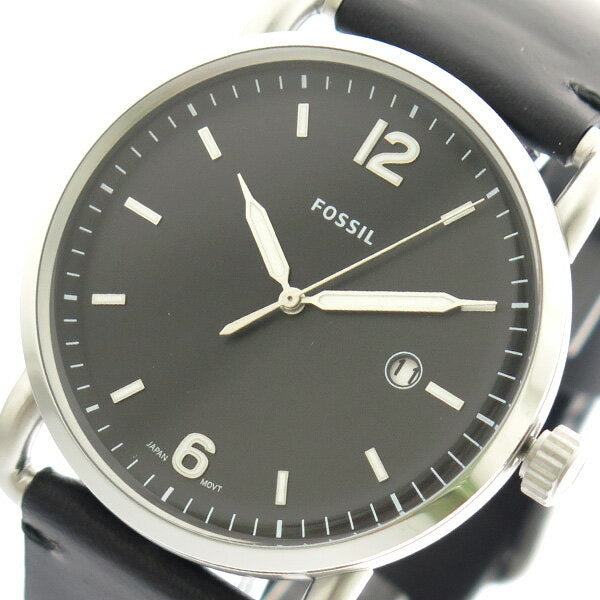 Close-up of Fossil Commuter dial with three hands, hour markers, date window at 3 o'clock