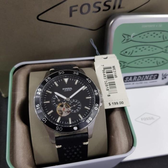 Fossil Crewmaster watch displayed in original retail packaging with Sardines-themed box and price tag
