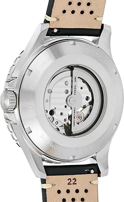 Open caseback revealing automatic movement and rotor through transparent exhibition window