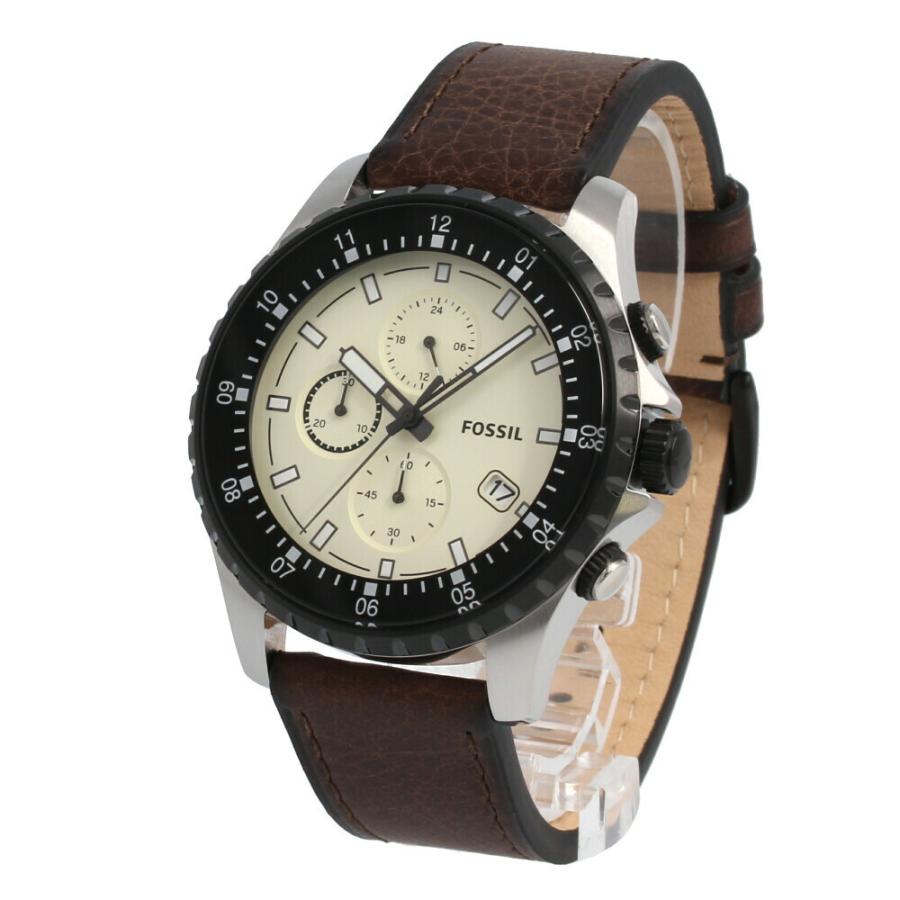 Fossil Dillinger chronograph watch worn on wrist displaying cream dial and brown leather band