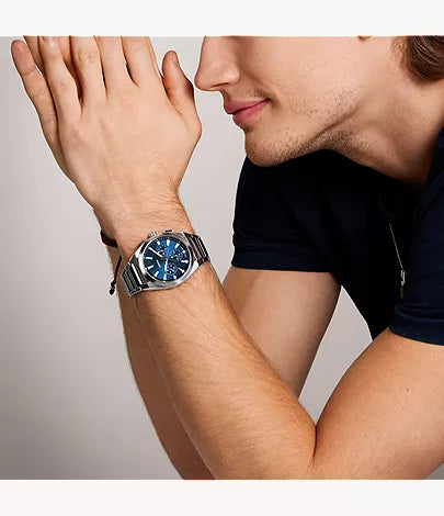 Fossil Everett FS6104 chronograph watch worn on wrist by man in black shirt