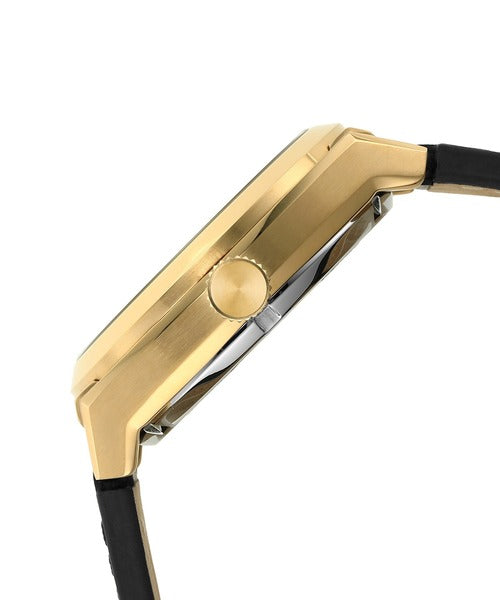 Side profile of Fossil Everett watch showing gold-tone case and crown detail