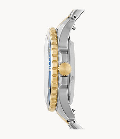 Side profile of Fossil FB-01 two-tone watch showing silver and gold stainless steel bracelet