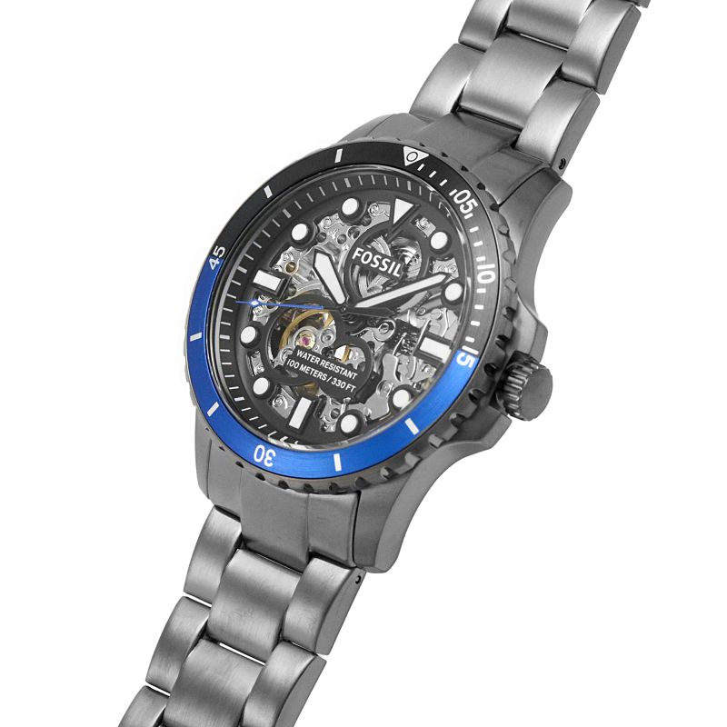 Fossil FB-01 watch angled view showing dial detail and blue bezel with stainless steel links