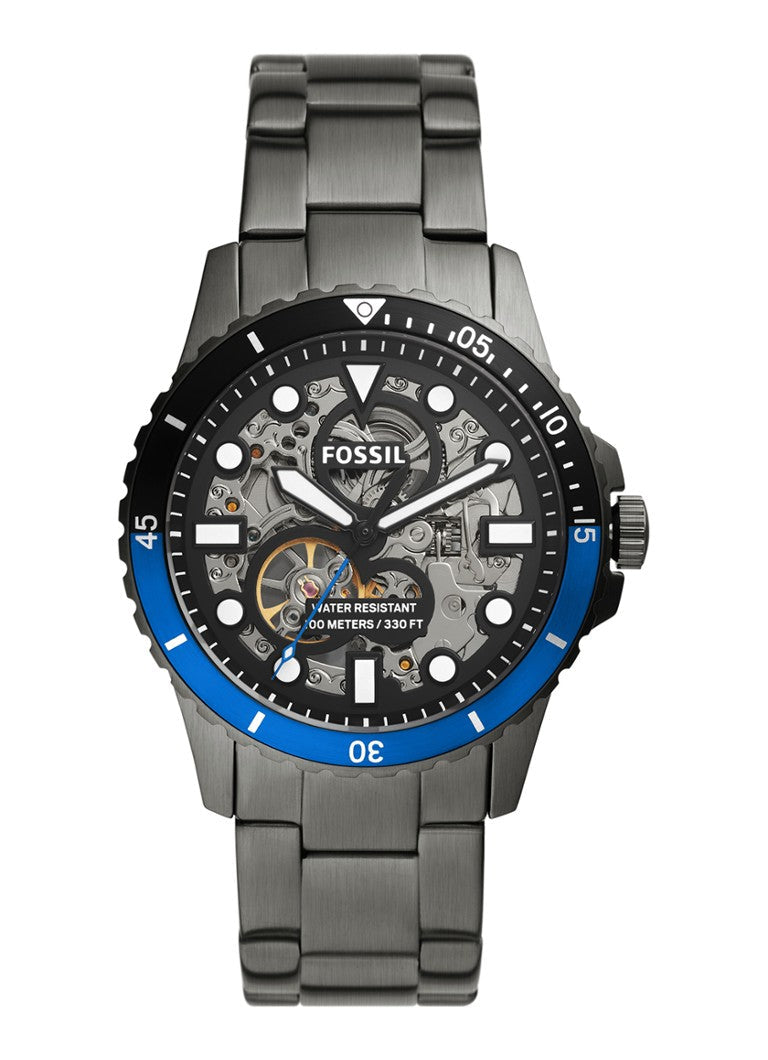 Fossil FB-01 automatic men's watch with skeleton dial, blue bezel, and stainless steel bracelet