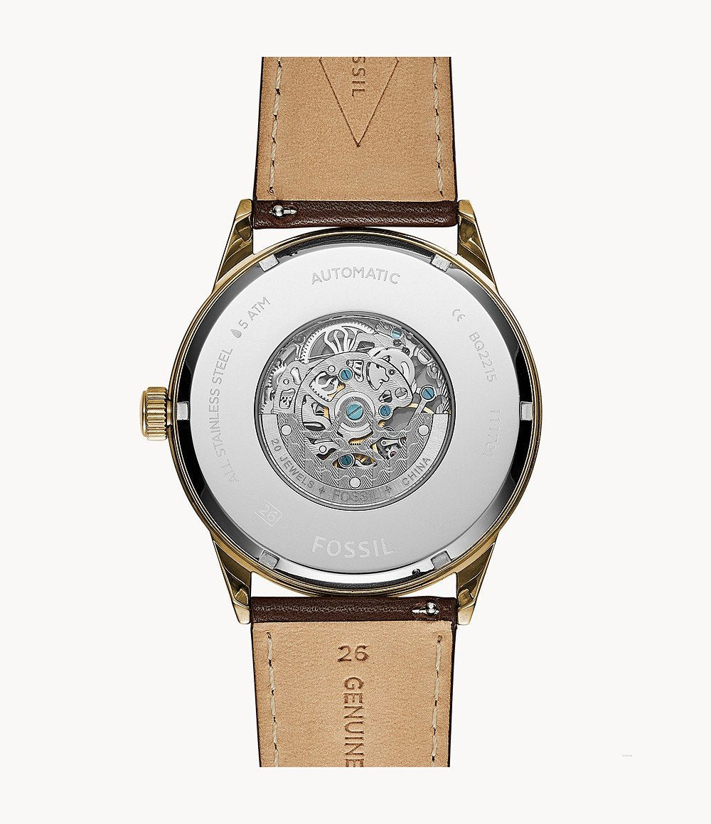 Fossil Flynn caseback displaying automatic movement and skeleton mechanism visible through window