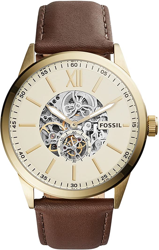 Fossil Flynn mechanical watch with skeleton dial, brown leather strap, and gold-tone case