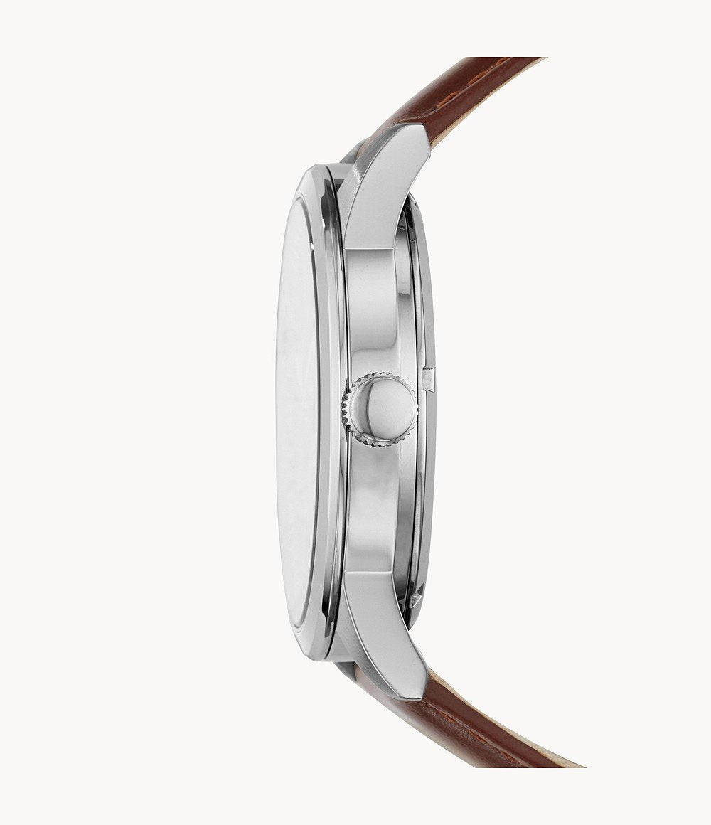Side view of Fossil Flynn watch showing silver case, crown, and brown leather strap