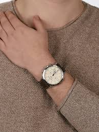 Fossil Forrester FS5696 cream dial watch worn on wrist with brown leather strap