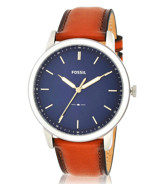 Fossil FS5304 watch displayed at angle showing navy dial and tan leather band
