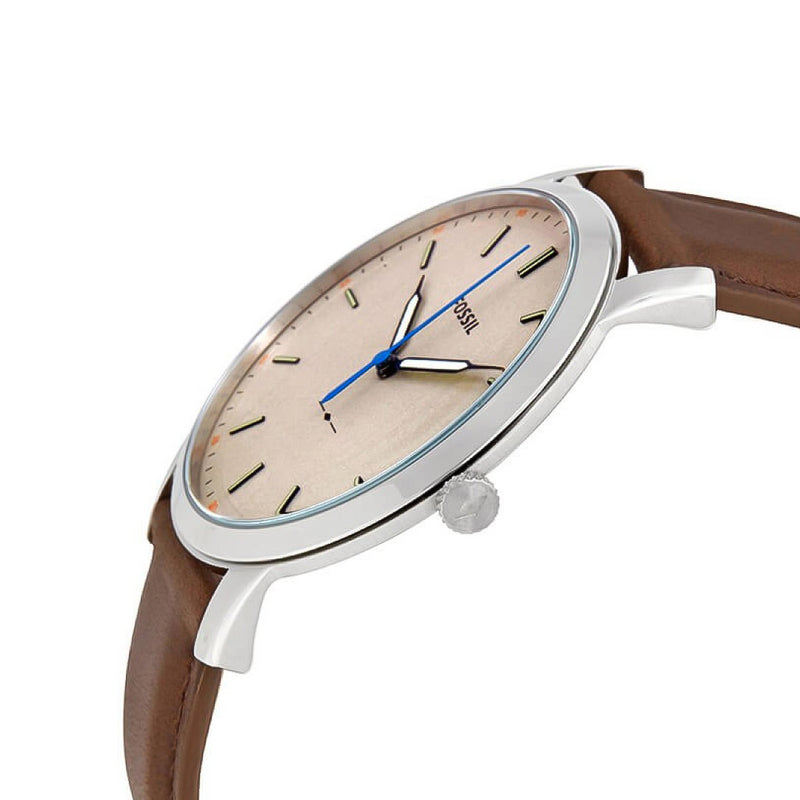 Fossil FS5306 minimalist watch worn on wrist showing off-white dial and blue hands