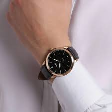 Fossil The Minimalist FS5376 watch on wrist showing black dial and rose gold case