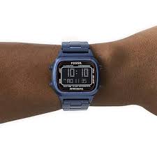 Fossil FS5896 retro digital watch worn on wrist with blue steel bracelet
