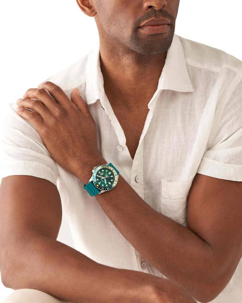 Fossil FS5992 men's watch on wrist with teal blue dial and silver case