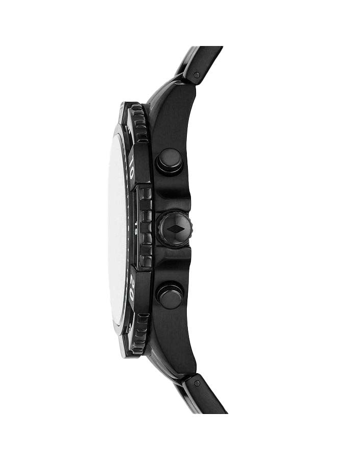 Fossil Garrett watch shown from the side with black steel bracelet and pushers
