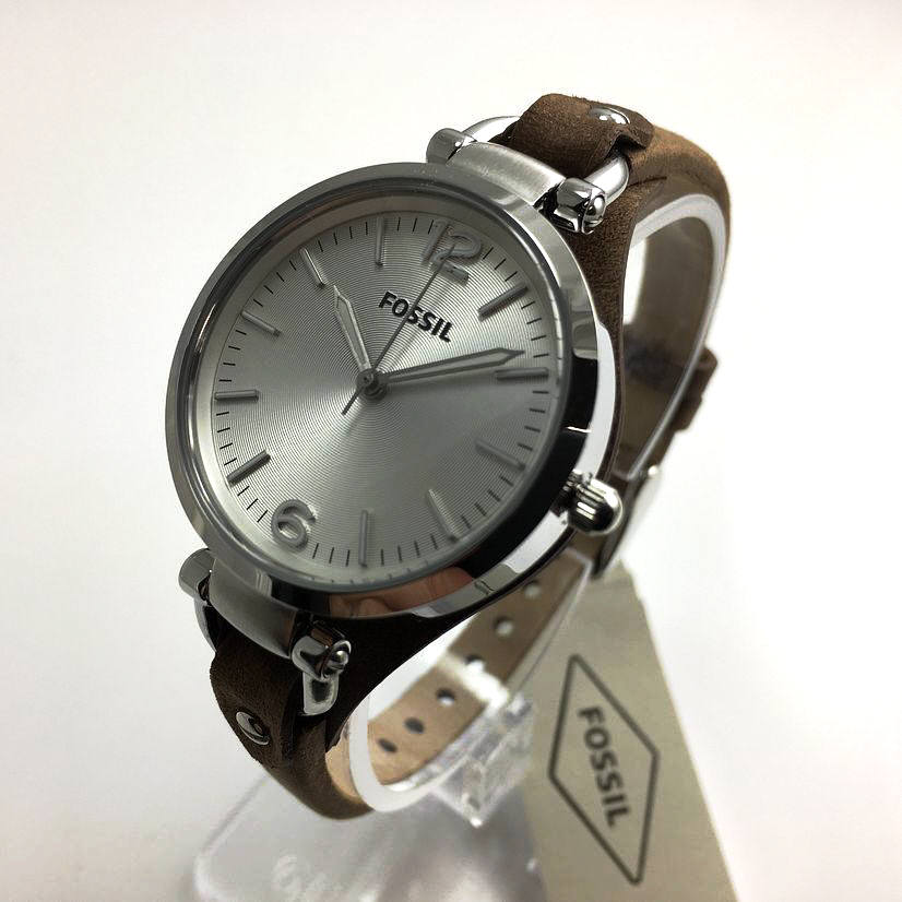 Fossil Georgia watch displayed on stand with silver dial and tan leather strap