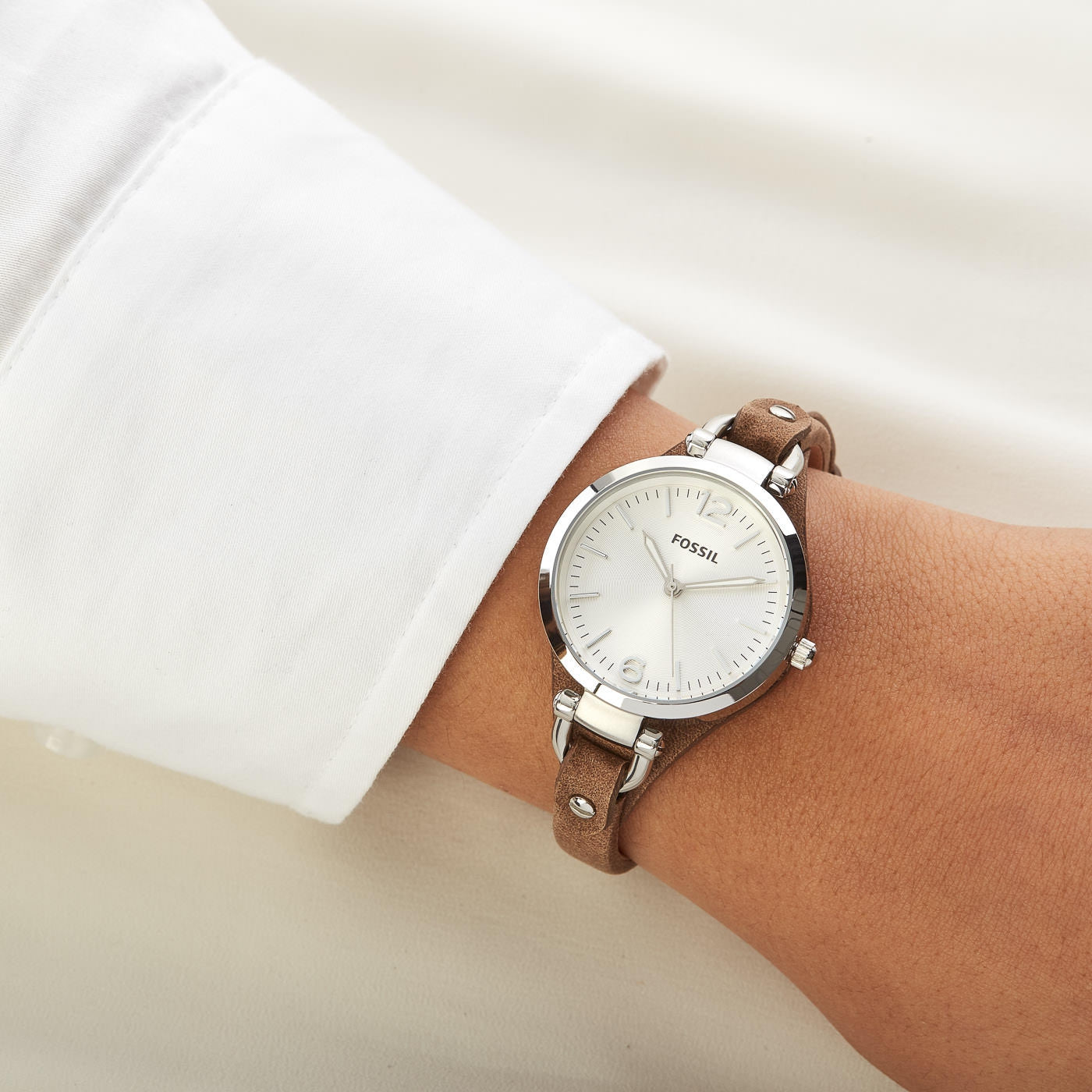 Fossil Georgia ladies watch worn on wrist with tan leather strap