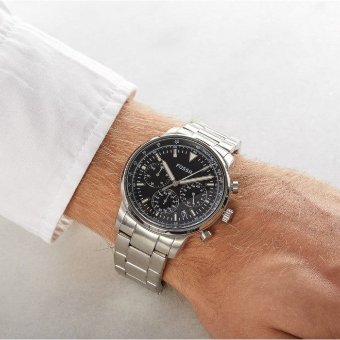 Fossil Goodwin chronograph on wrist showing black dial with chronograph sub-dials and silver-tone bracelet