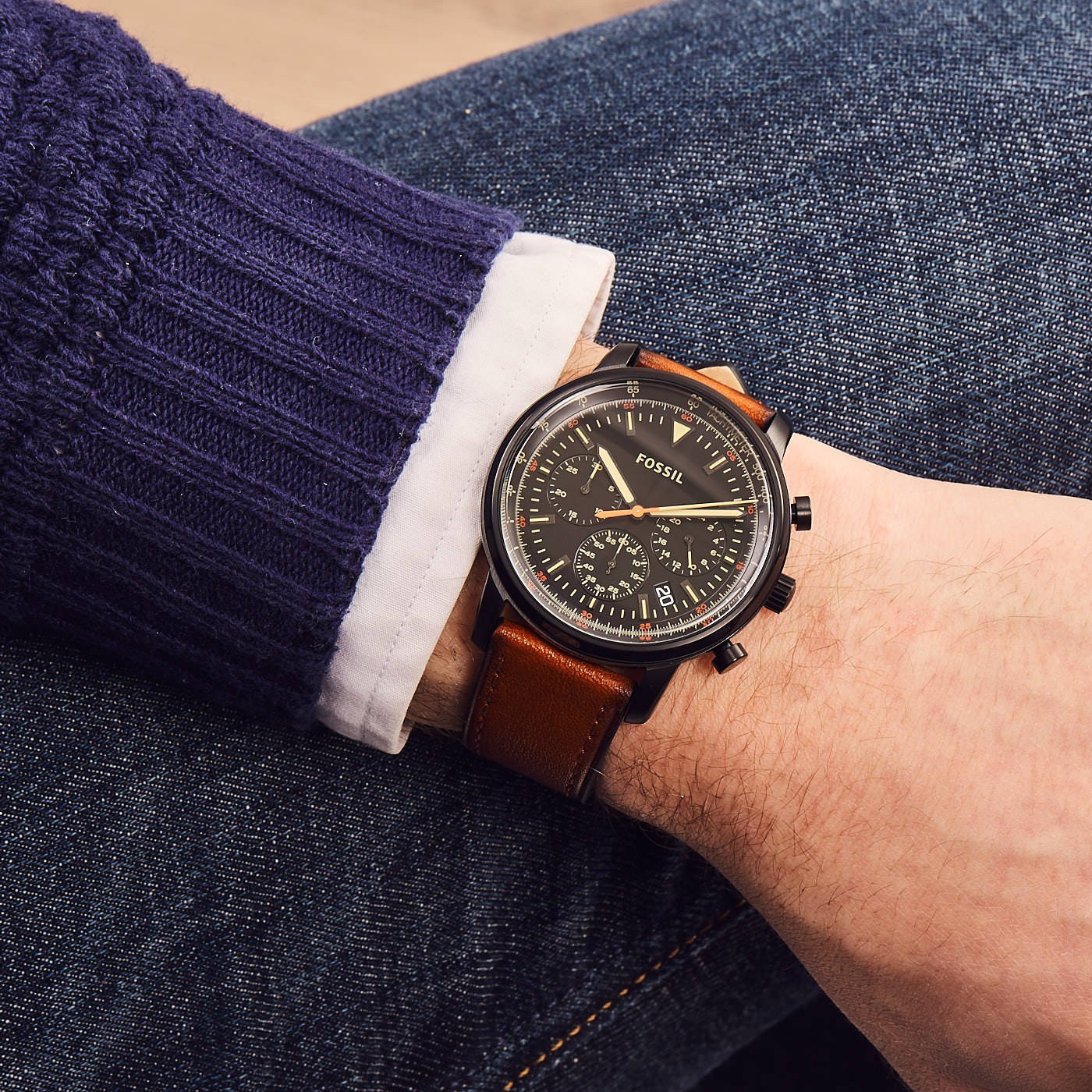Fossil Goodwin chronograph watch worn on wrist with tan leather strap and black dial