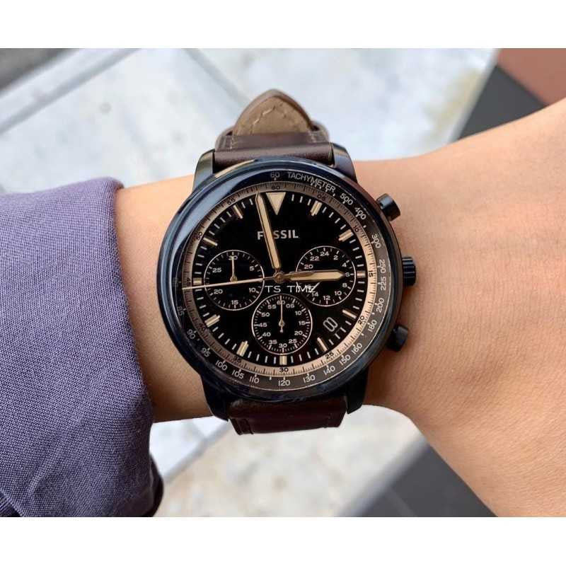 Fossil Goodwin chronograph watch worn on wrist with black dial and brown leather strap