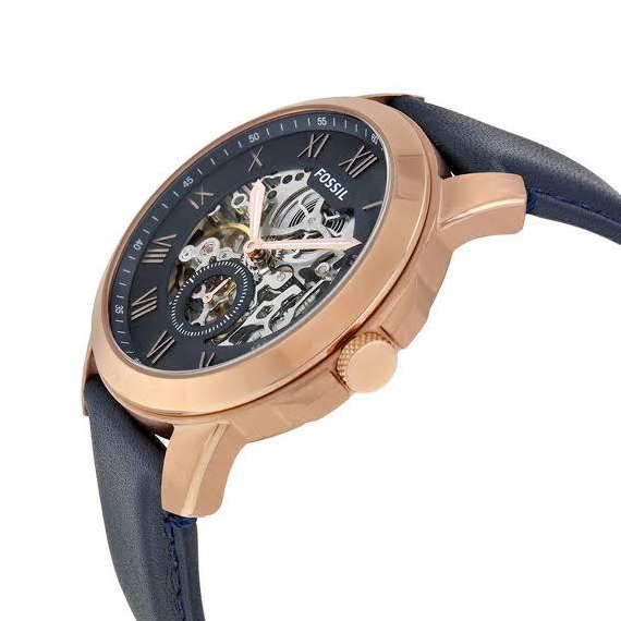 Side angle view of Fossil Grant watch showing rose gold case and blue leather strap detail