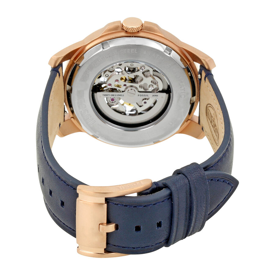 Fossil Grant watch caseback revealing automatic movement mechanism and transparent exhibition display