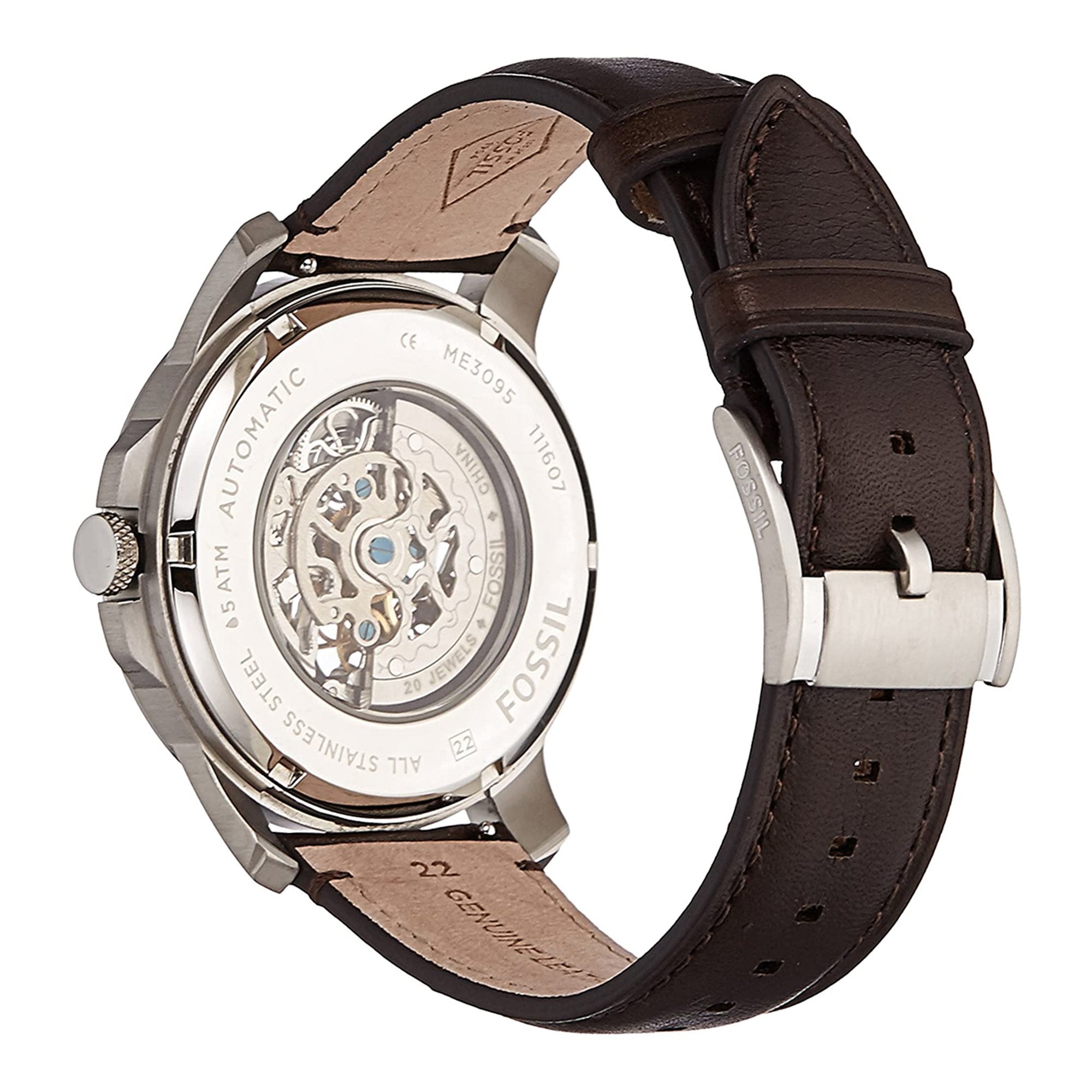 Side view of Fossil Grant watch showing silver case, brown leather strap, and transparent caseback