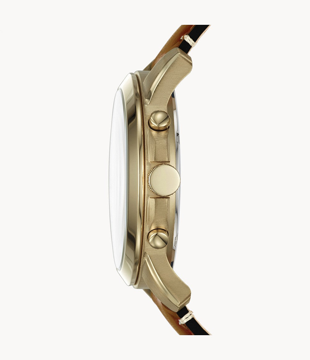Side view of Fossil Grant watch showing gold-tone case profile and brown leather strap attachment