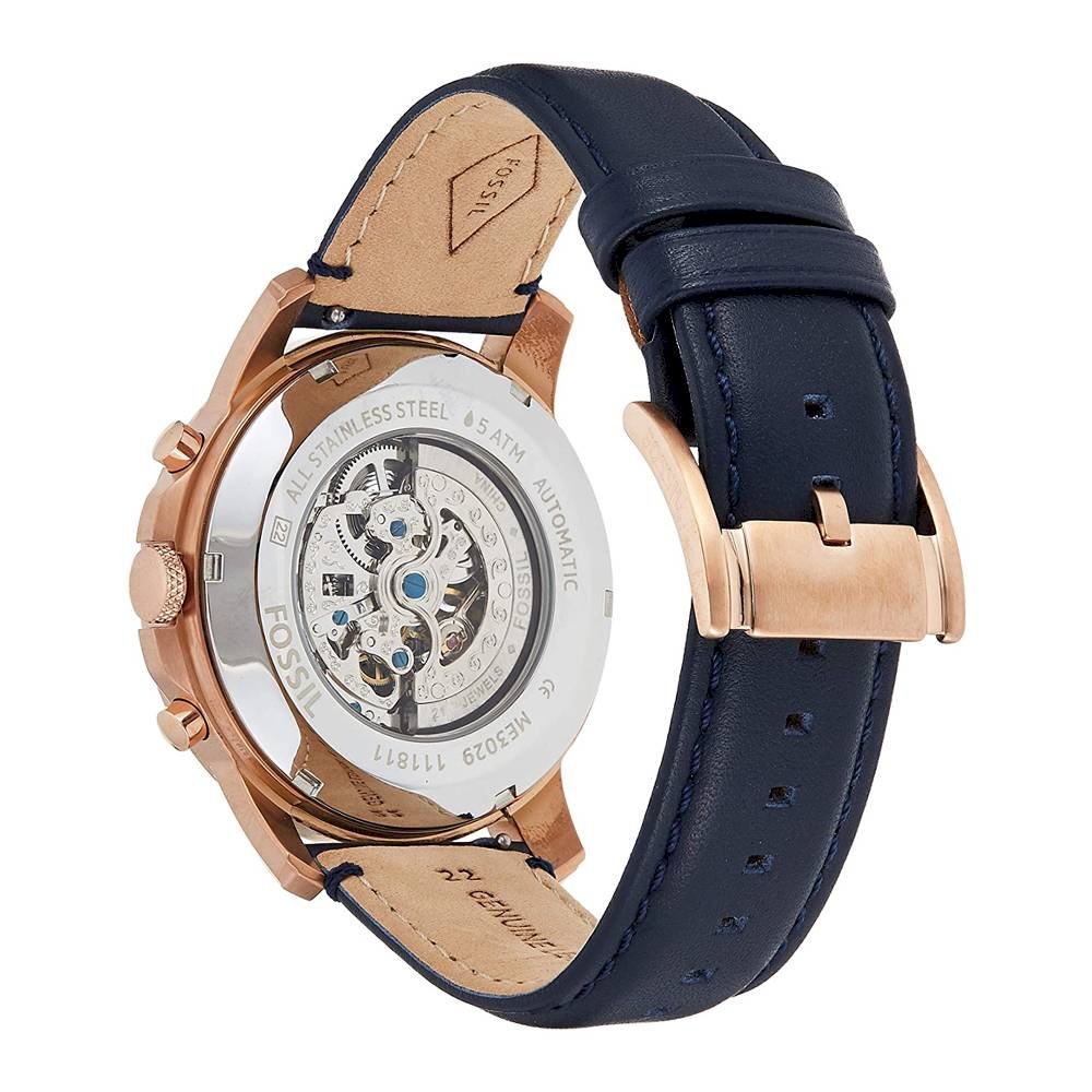 Fossil Grant watch caseback showing skeletal automatic movement and navy leather strap