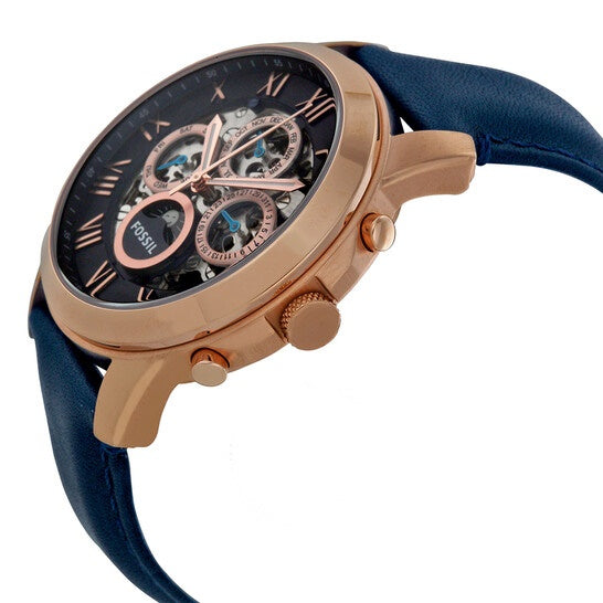 Side angle view of Fossil Grant watch showing rose gold case and navy strap