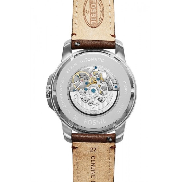 Fossil Grant automatic watch caseback showing transparent skeleton movement and brown leather strap