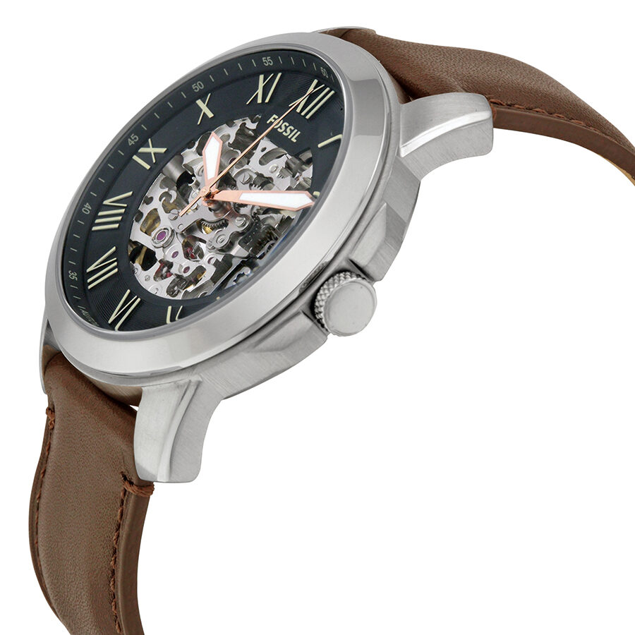 Fossil Grant automatic watch side angle view showing stainless steel case and leather strap