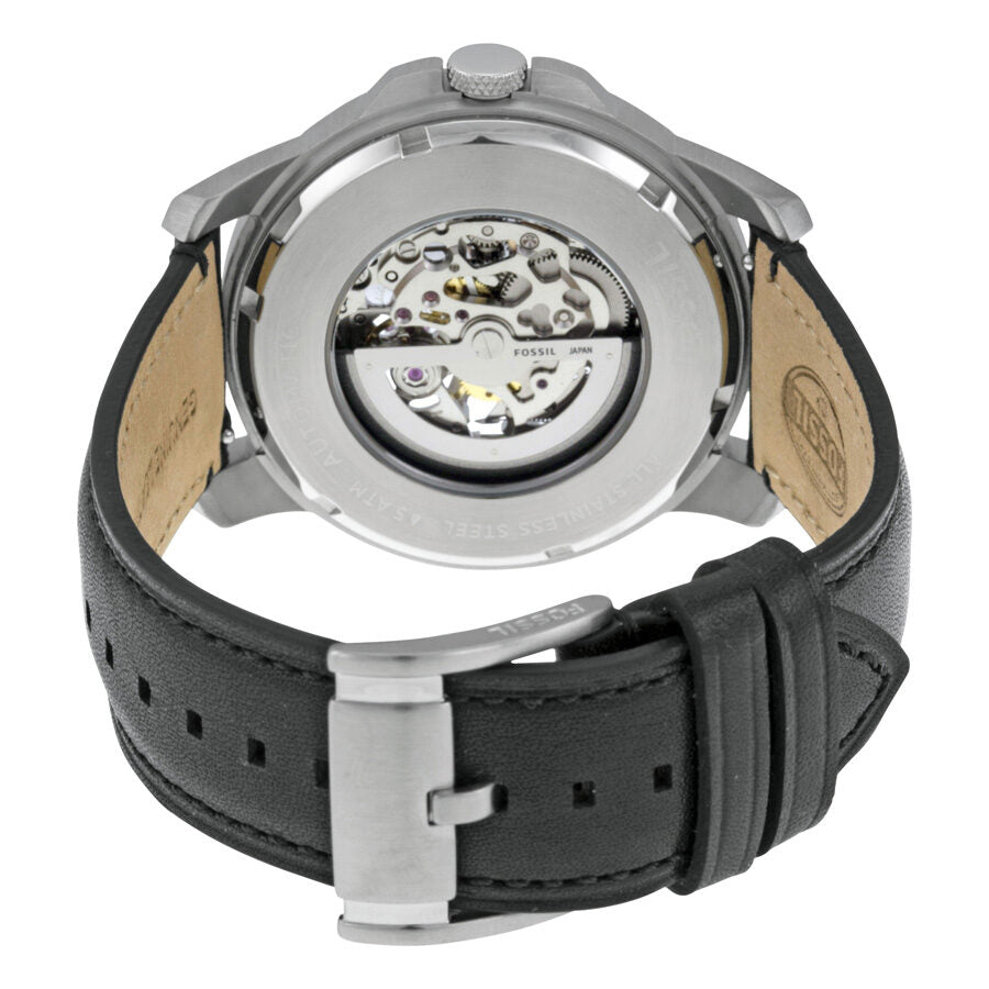 Caseback view of Fossil Grant automatic watch displaying skeleton movement and black leather strap