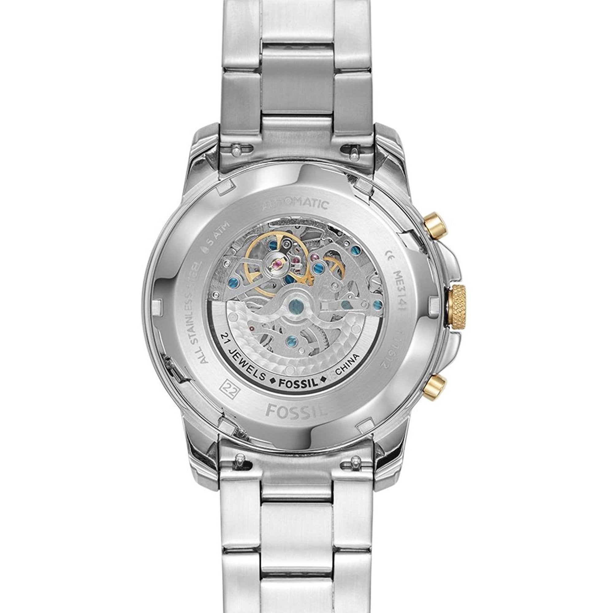 Fossil Grant watch angled view showing silver and gold-tone bracelet and skeleton caseback