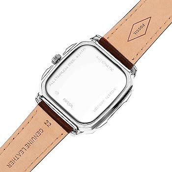 Fossil Inscription watch caseback showing engraving and brown leather strap