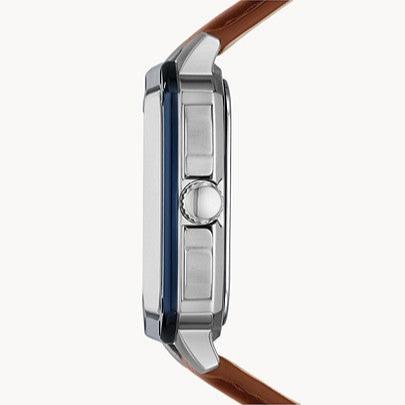 Fossil Inscription watch side profile with blue case edge, stainless steel, and brown strap