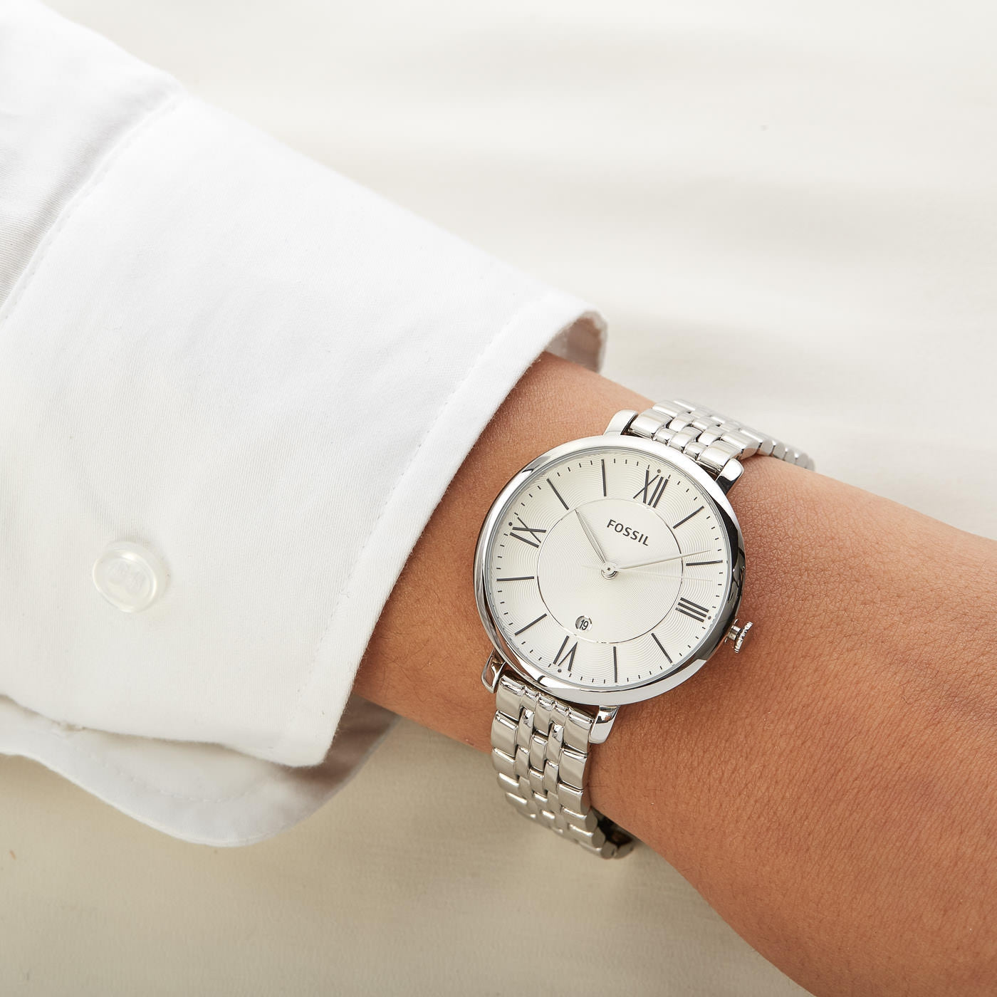 Fossil Jacqueline watch worn on wrist with silver bracelet and white dial