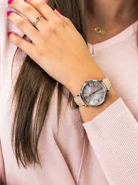 Fossil Jacqueline watch on wrist with beige strap and mother of pearl dial