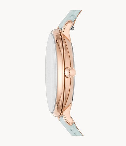 Side view of Fossil Jacqueline watch showing rose gold case profile with mint green leather strap