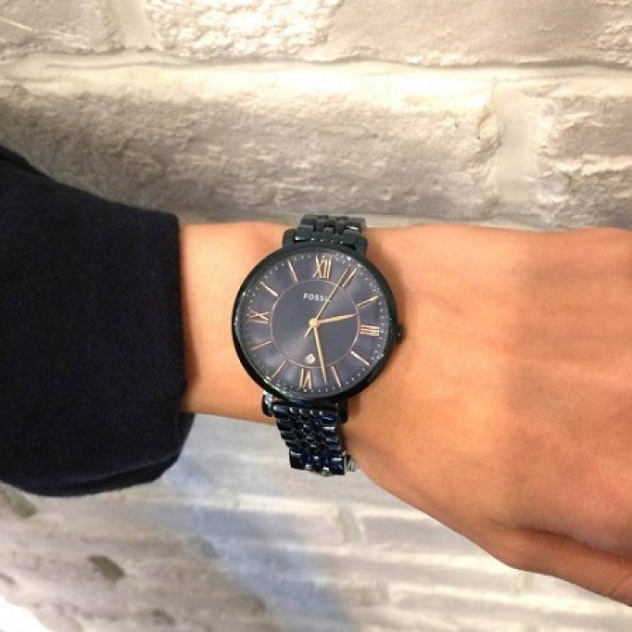 Fossil Jacqueline navy blue watch worn on wrist with navy bracelet