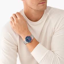 Fossil Jesse watch worn on wrist, showing blue chronograph dial