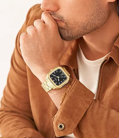 Fossil Machine Chrono watch worn on wrist with gold case and black dial