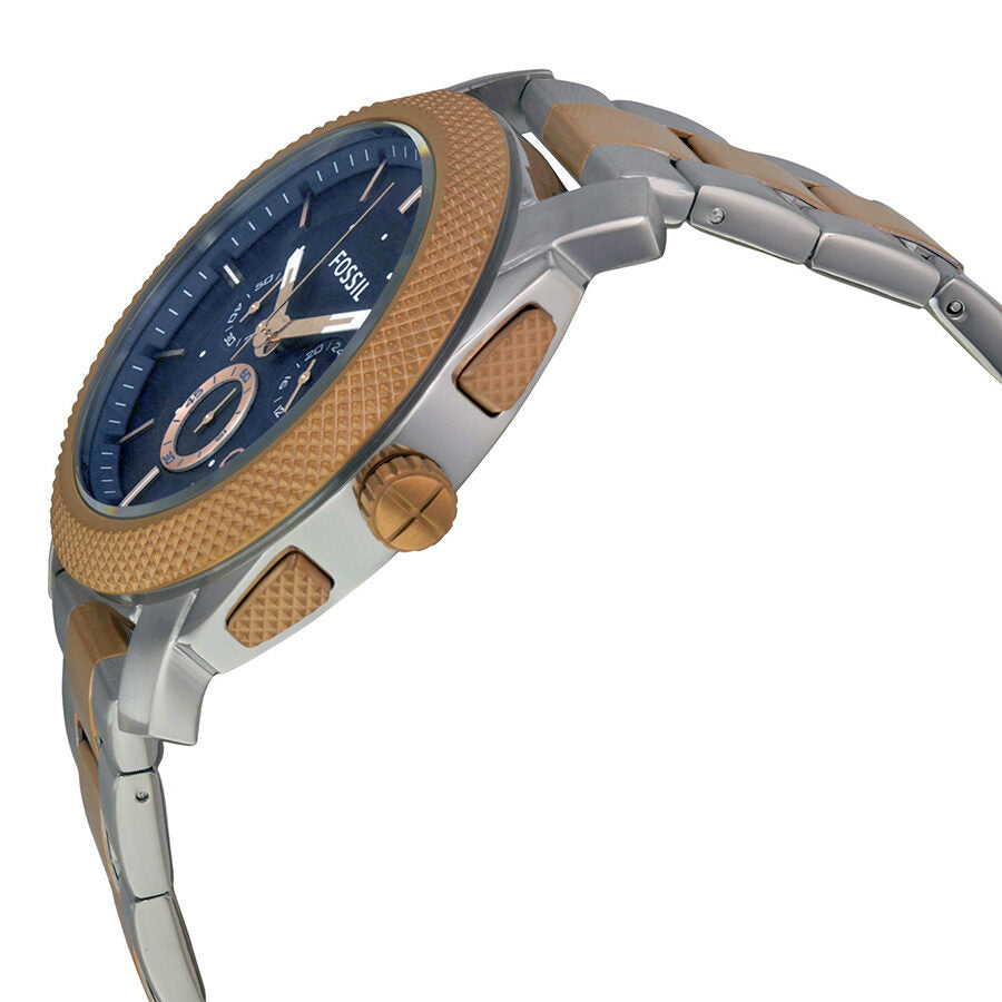Side angle view of Fossil Machine chronograph with blue dial, two-tone bracelet, and rose gold accents