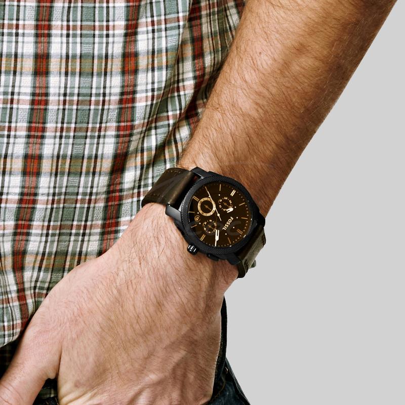 Fossil Machine Chronograph men's watch on wrist showing brown dial with rose gold chronograph hands