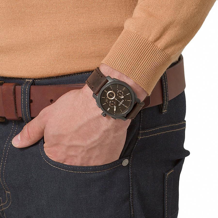 Fossil Machine Chronograph watch worn on wrist with brown leather strap and black case