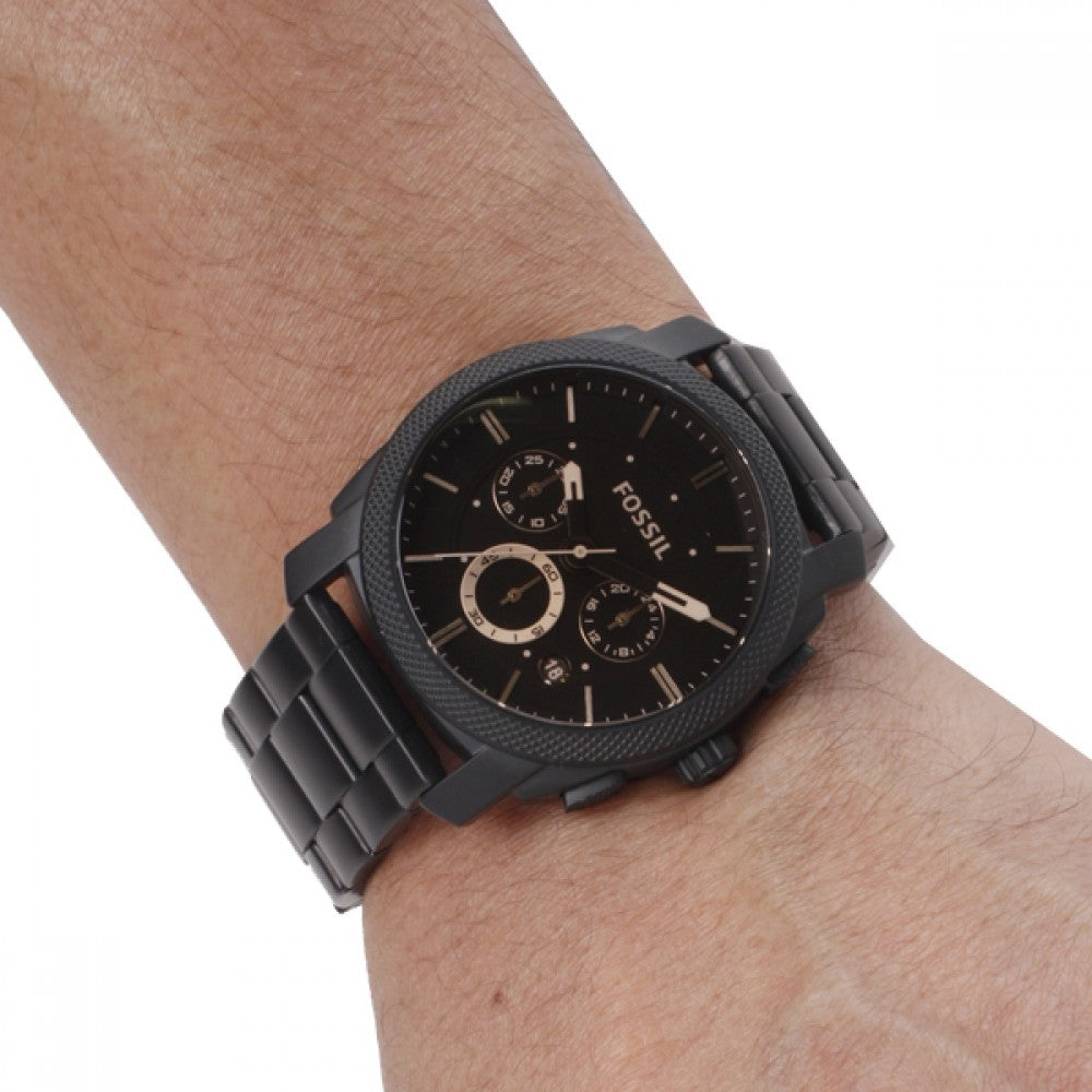 Fossil Machine FS4682 chronograph watch on wrist showing dial and bracelet detail