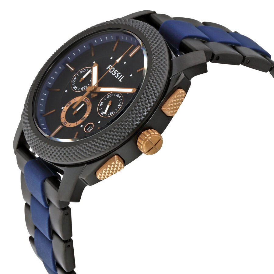 Side angle view of Fossil Machine chronograph showing textured case, rose gold pushers, and blue steel bracelet
