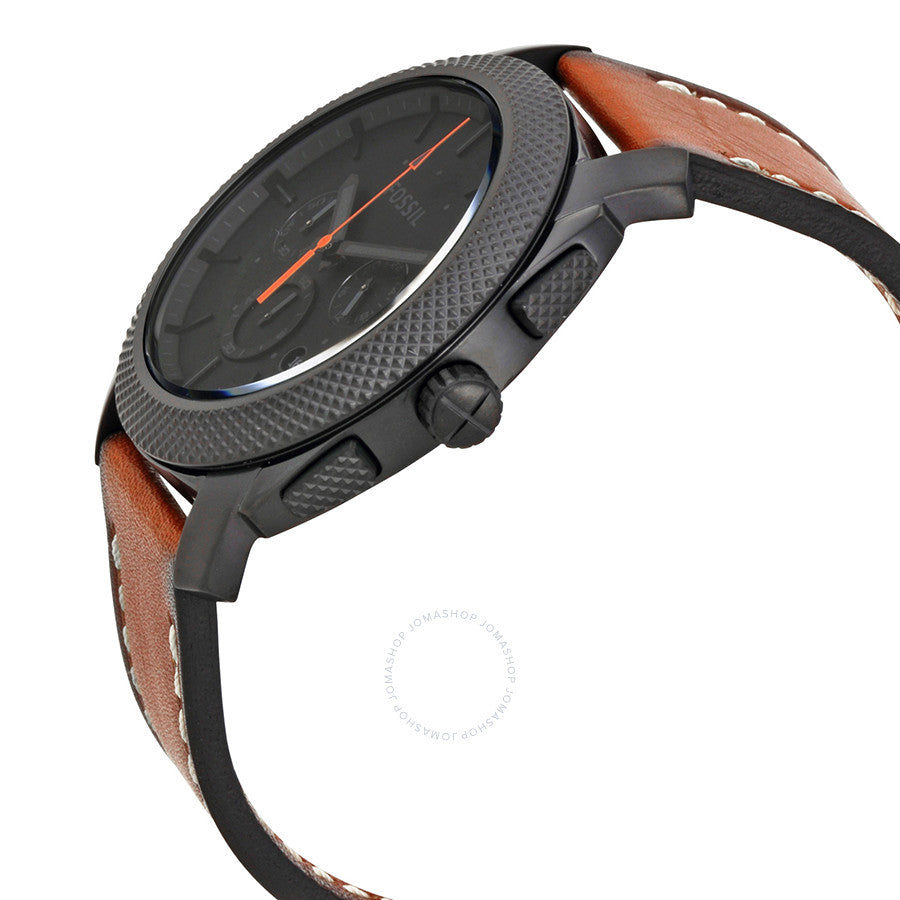 Fossil Machine chronograph watch at angle showing textured case, black dial, and brown leather strap