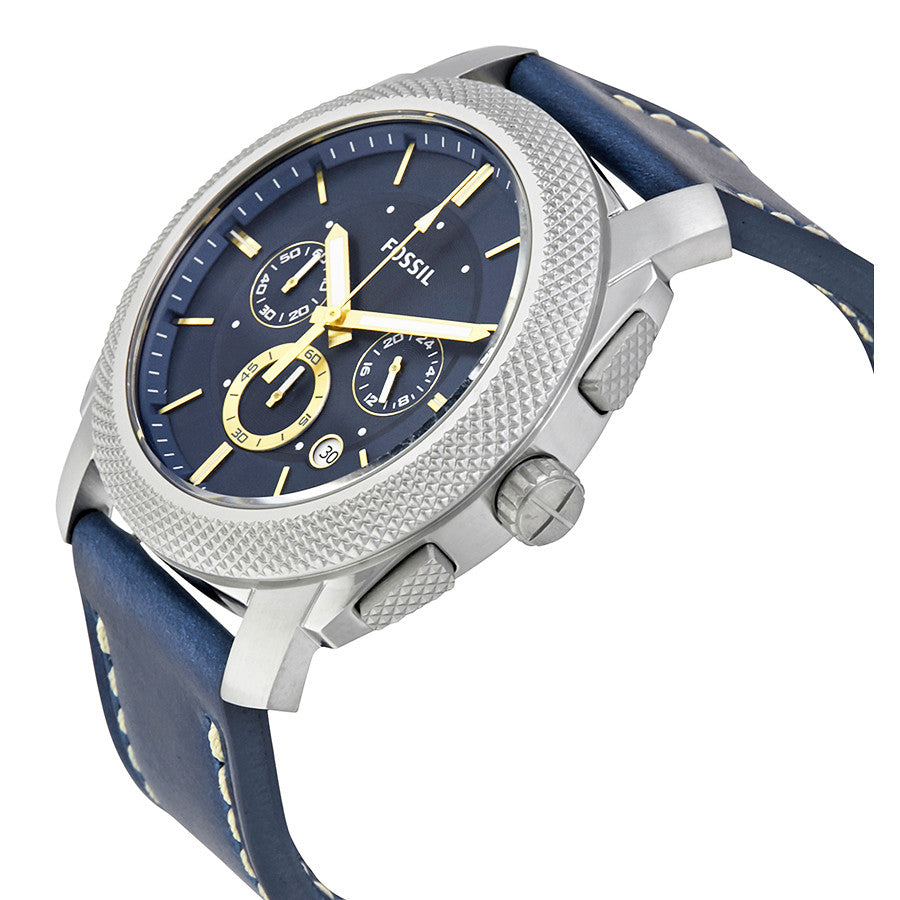 Fossil Machine chronograph watch at angle showing silver case, blue dial, and navy leather strap